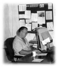 John Kinderman at work at his Identification Unit work station.