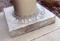 Photo of time capsule base with word "Service"